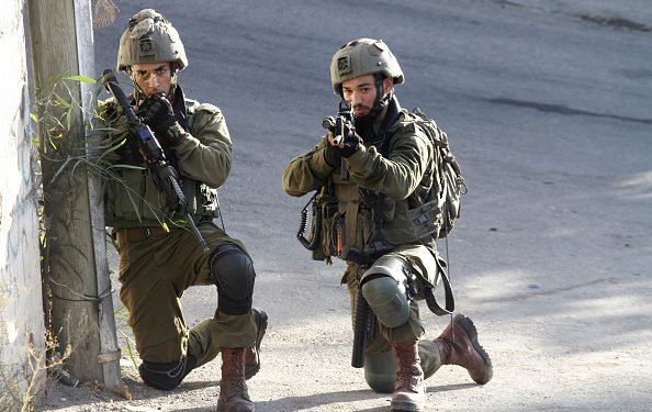 NABLUS, PALESTINE - 2021/08/23: Israeli forces take position during a search operation in Salem village, east of Nablus after Palestinians threw stones at a settler car on the road to Elon Moreh settlement. (Photo by Nasser Ishtayeh/SOPA Images/LightRocket via Getty Images)