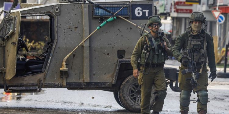 Israeli soldiers patrol on December 13, 2023 following an overnight army raid in Jenin in the occupied West Bank, as battles continue between Israel and the militant movement Hamas in Gaza. Israeli forces killed four Palestinians in Jenin on December 12, the Palestinian health ministry reported without further details on the fatalities, while the Palestinian Red Crescent Society said they were killed in a drone strike in the old town. (Photo by Zain JAAFAR / AFP)