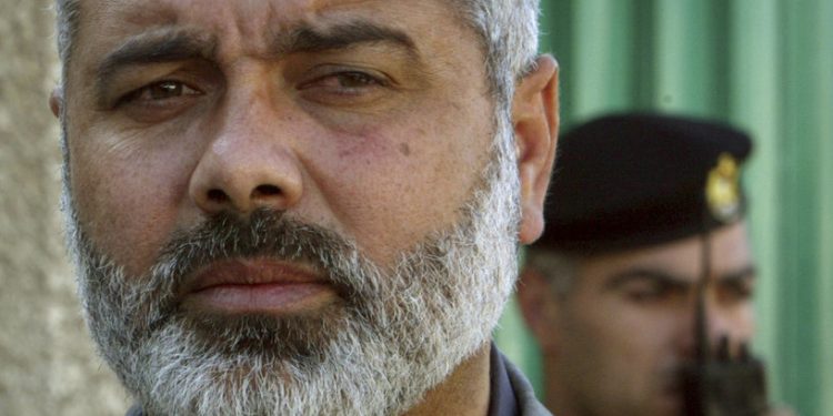 FILE - Palestinian Hamas leader Ismail Haniyeh speaks to the media after his meeting with Egyptian officials at the Egyptian diplomatic mission in Gaza City, Feb. 10, 2006. (AP Photo/Adel Hana, File)