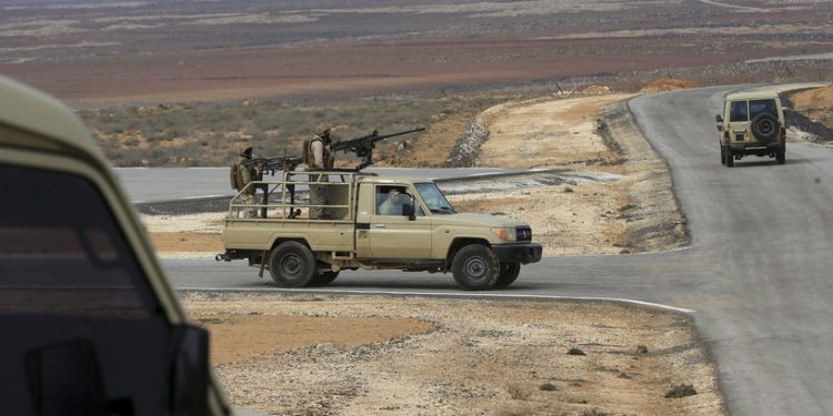 Jordanian soldiers patrol along the eastern Jordan-Syria border, in al-Washash, Mafraq governorate, Jordan, Thursday, Feb. 17, 2022, during media tour organised by the Jordanian army. Colonel Mustafa Al-Hiyari, head of the Military Information Directorate said Jordan is directly confronted with an undeclared war with drug smugglers and arms dealers. (AP Photo/Raad Adayleh)