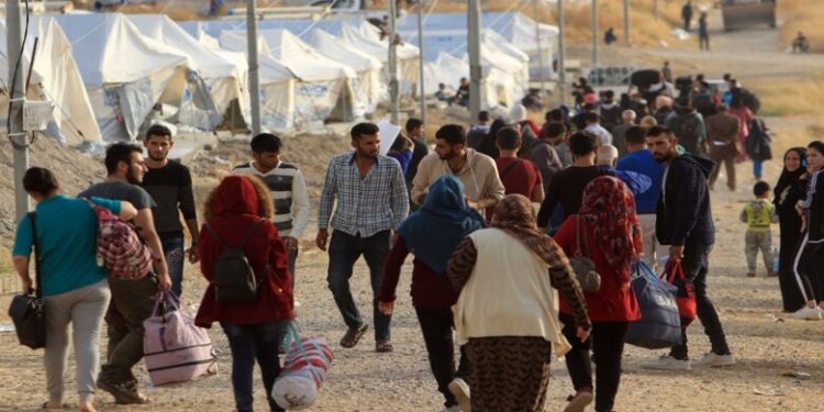 Syrian displaced families, who fled violence after the Turkish offensive in Syria, are seen upon arrival at a refugee camp in Bardarash on the outskirts of Dohuk, Iraq October 25, 2019. REUTERS/Ari Jalal