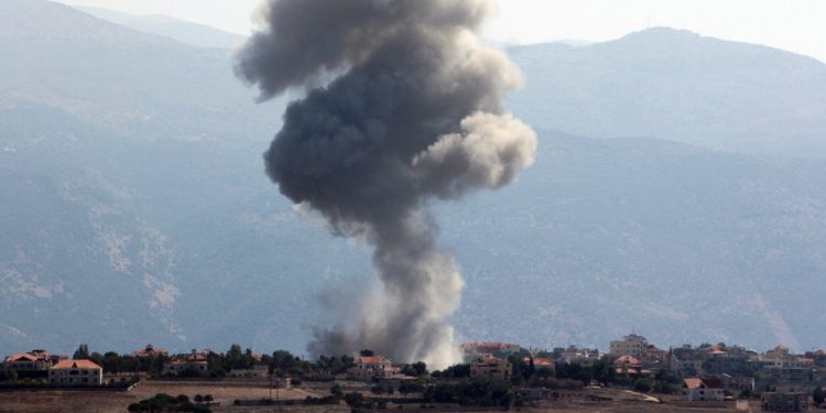 Smoke billows over Khiam, amid ongoing cross-border hostilities between Hezbollah and Israeli forces, as pictured from Marjayoun, near the Lebanese border with Israel, September 30, 2024. REUTERS/Karamallah Daher