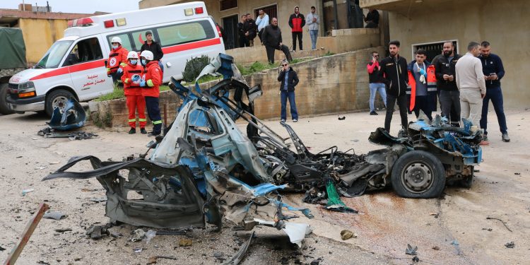 Lebanese medics arrive at the site of an Israeli drone attack targeting a vehicle in the town of Souairi, in western Bekaa Valley in central Lebanon on March 24, 2024, amid ongoing cross-border tensions as fighting continues between Israel and Hamas militants in the Gaza Strip. An Israeli strike on a car near the Syrian border killed a man Sunday, a security source said, after overnight fire wounded four people in Lebanon's east, according to an AFP correspondent. (Photo by Hassan JARRAH / AFP)